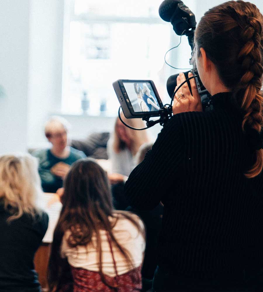 Videographer shooting video of office